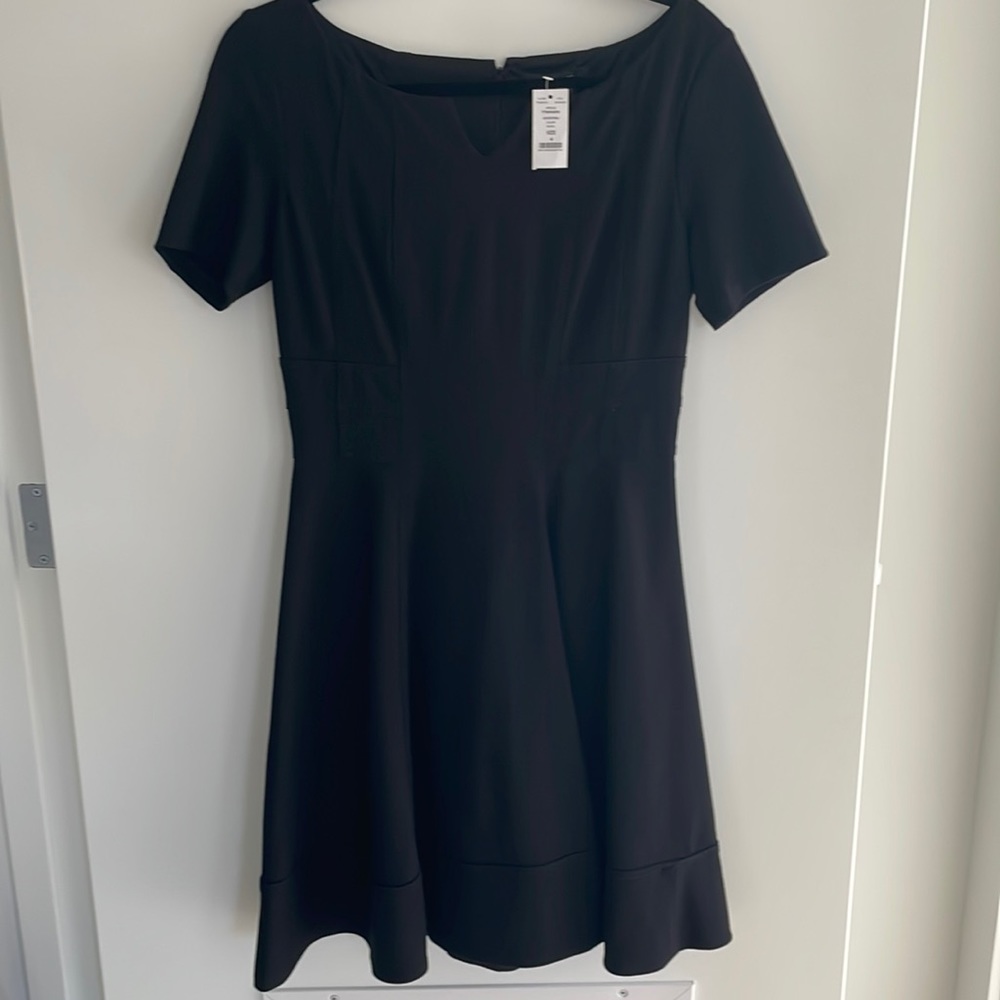 White House Black Market black dress, with A line flare , size 4